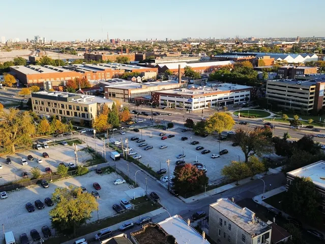 a view of a room with a window and wooden floor