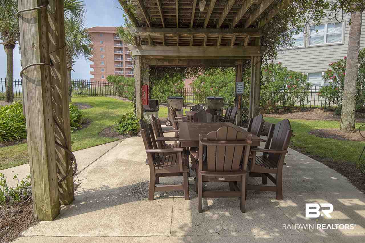 27284 Gulf Road, Unit 213 Orange Beach, AL 36561 - Photo 4 of 40 Bar b Que area w/ gill & seating.
