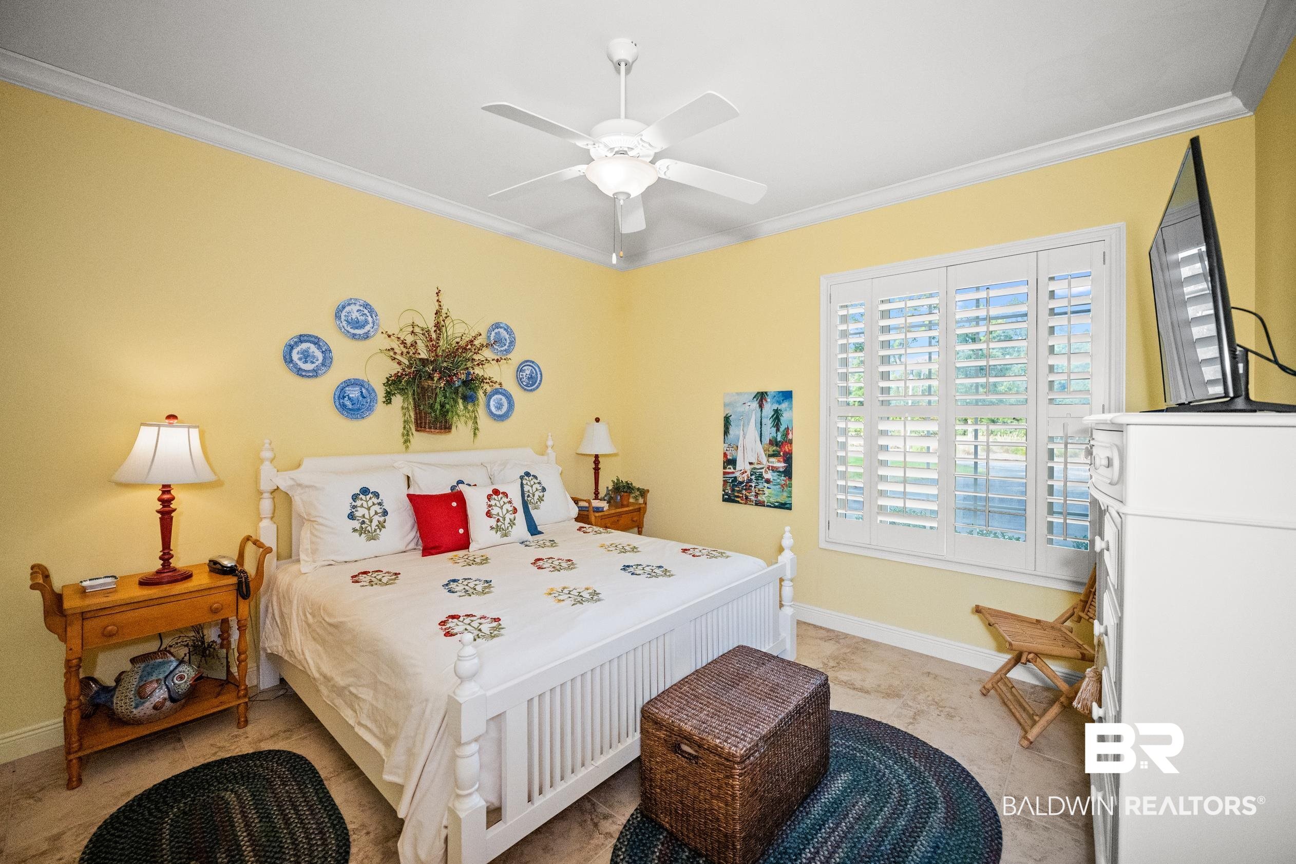 404 Peninsula Boulevard Gulf Shores, AL 36542 - Photo 13 of 51 Bedroom with crown molding and a ceiling fan