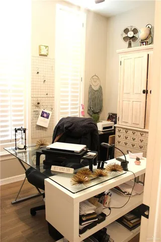 a living room with a stove and a window