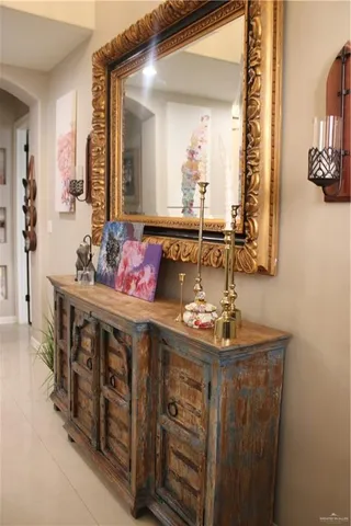 a bathroom with a sink vanity and mirror
