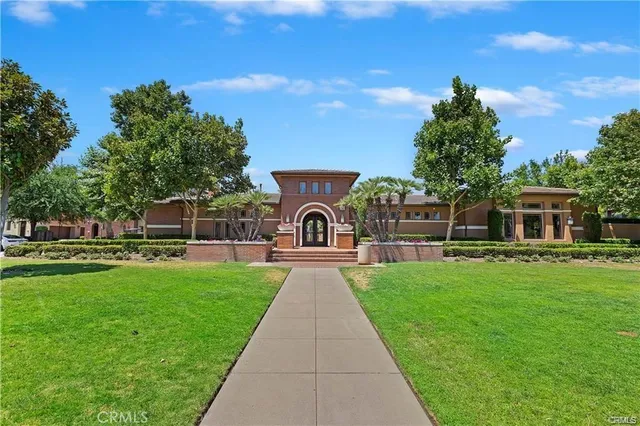 a front view of a house with yard