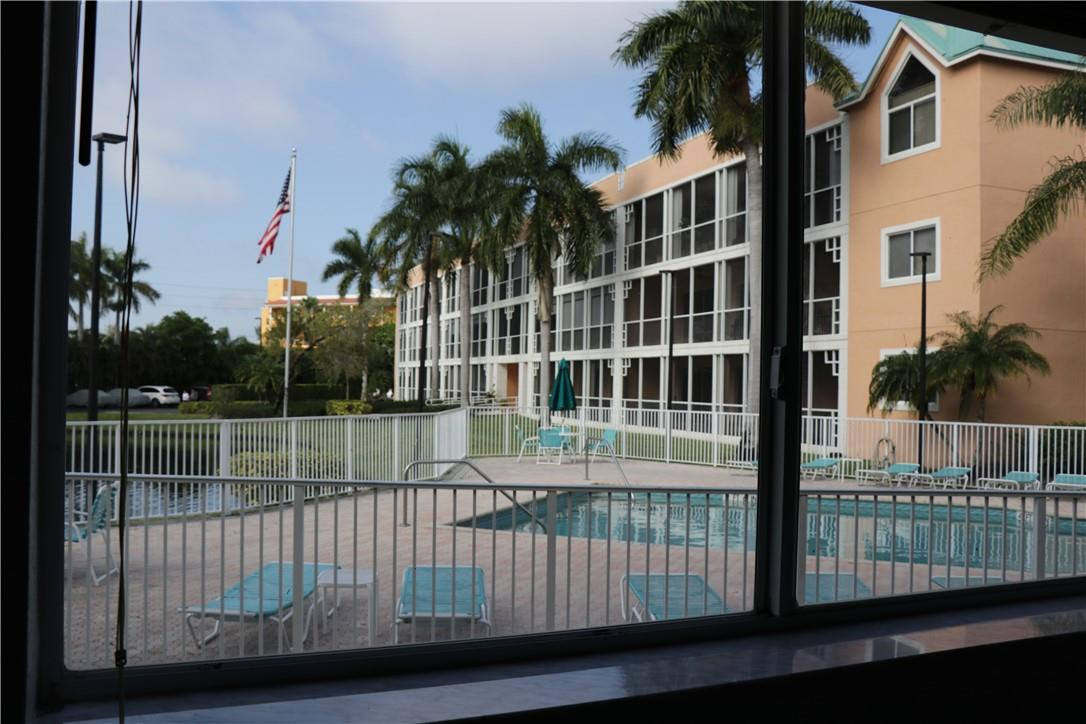 75 Gulfstream Road, Unit 112 Dania Beach, FL 33004 - Photo 9 of 44 Pool and pond view