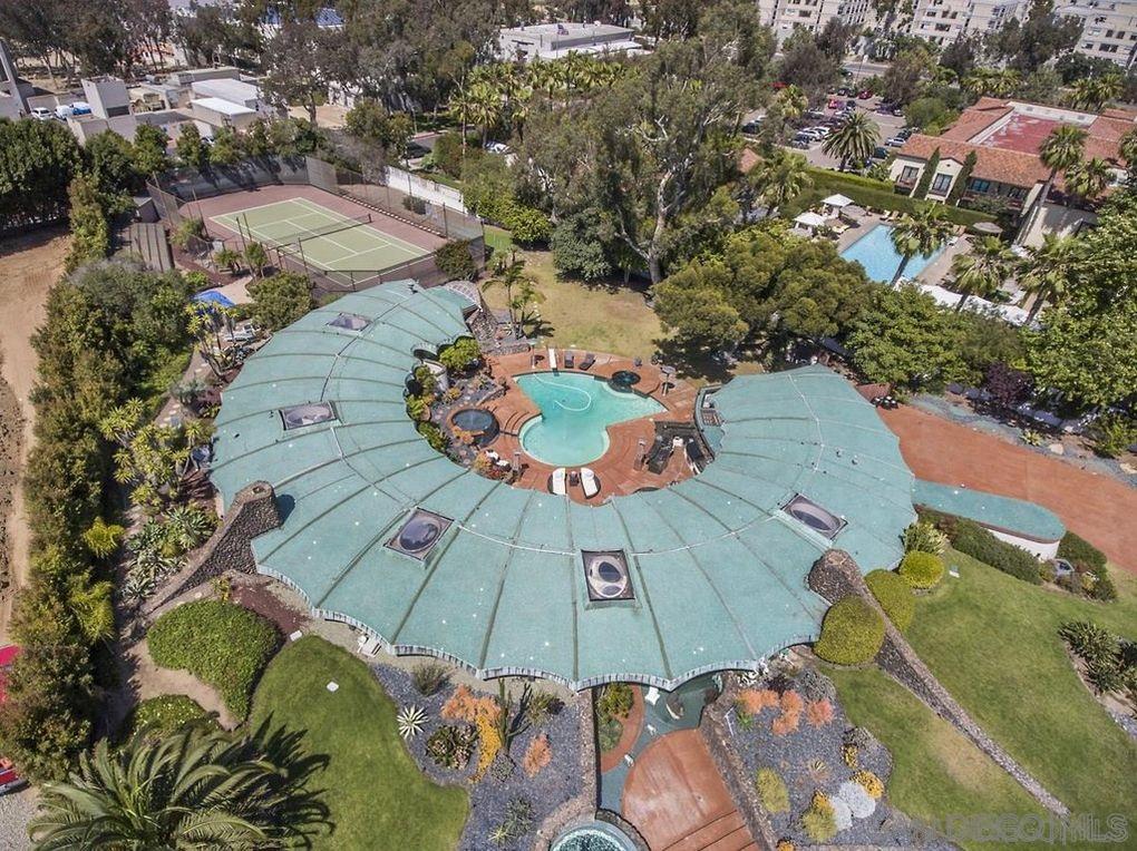 an aerial view of a house with outdoor space