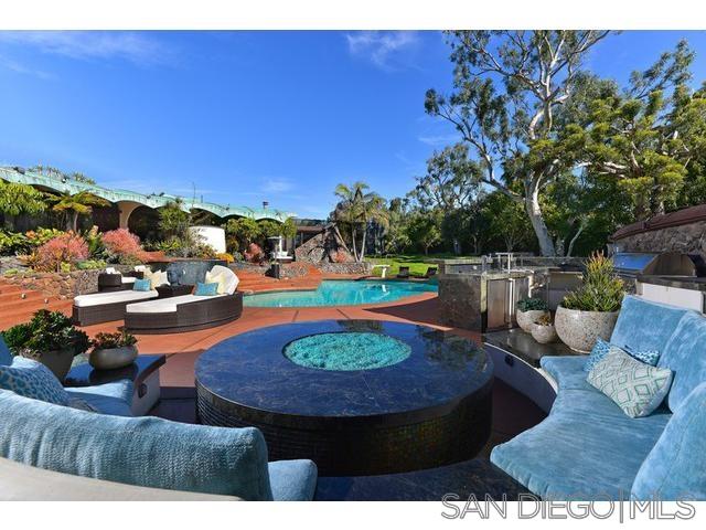 9805 Blackgold Road La Jolla, CA 92037 - Photo 2 of 32 a view of a swimming pool with outdoor seating