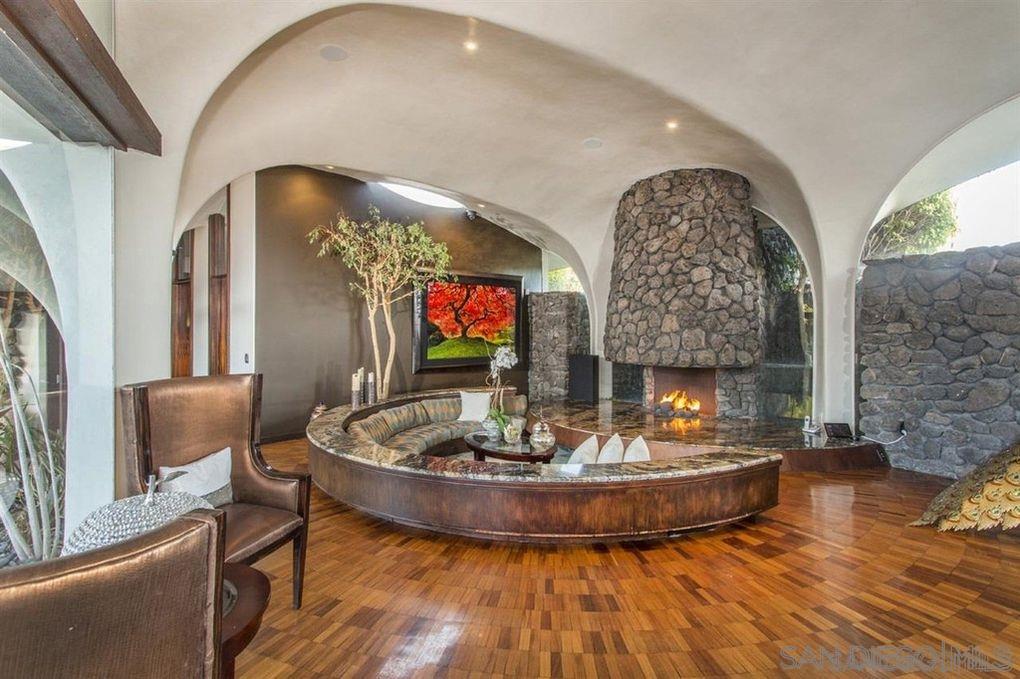 9805 Blackgold Road La Jolla, CA 92037 - Photo 17 of 32 a view of a living room and a fireplace