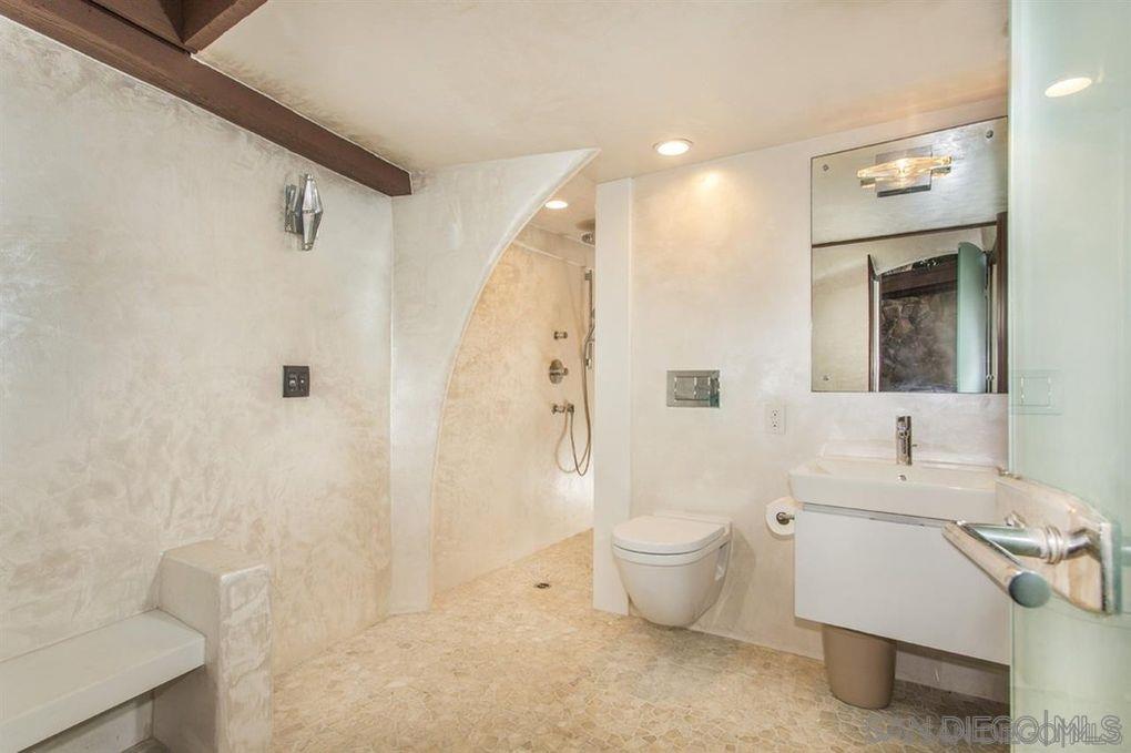 9805 Blackgold Road La Jolla, CA 92037 - Photo 24 of 32 a bathroom with a toilet sink and shower