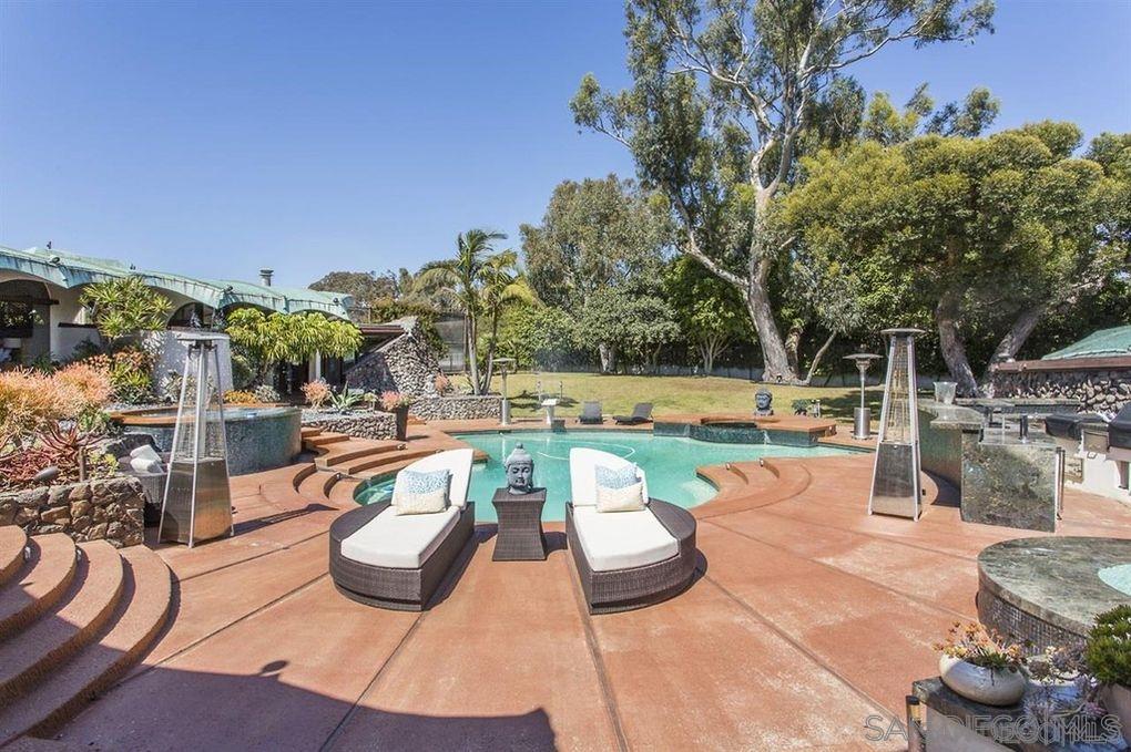 9805 Blackgold Road La Jolla, CA 92037 - Photo 26 of 32 a view of a swimming pool with a patio