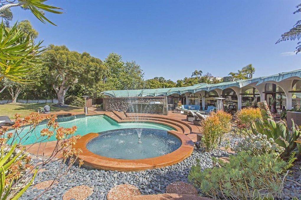 9805 Blackgold Road La Jolla, CA 92037 - Photo 28 of 32 a view of a swimming pool with a patio