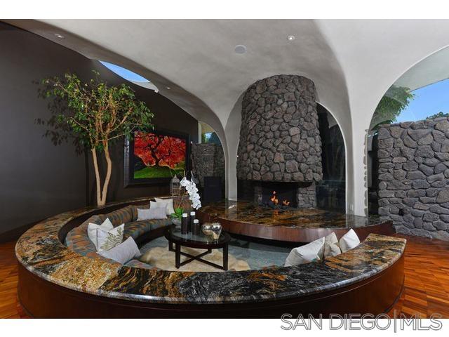 9805 Blackgold Road La Jolla, CA 92037 - Photo 6 of 32 a living room with furniture and a fireplace