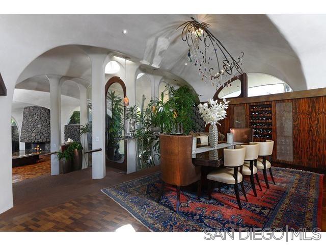 9805 Blackgold Road La Jolla, CA 92037 - Photo 7 of 32 a view of a dining room with furniture and wooden floor