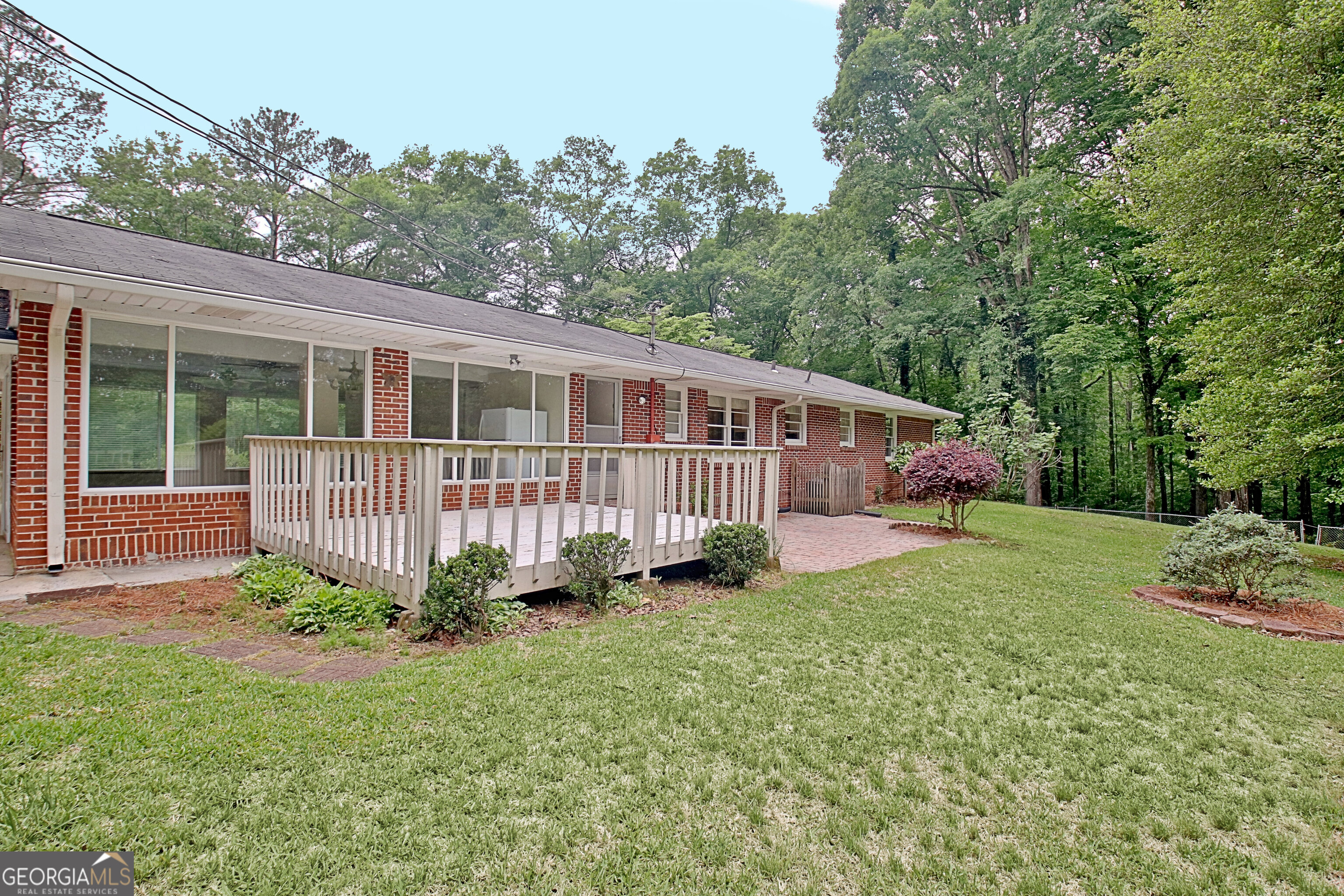 717 Tyrone Road Tyrone, GA 30290 - Photo 48 of 58 a view of a house with a yard and a garden