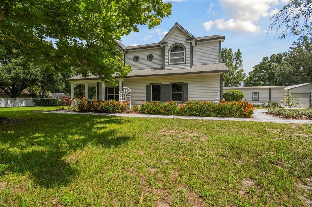 15504 Race Track Road Odessa, FL 33556 - Photo 1 of 1 a front view of house with yard and green space