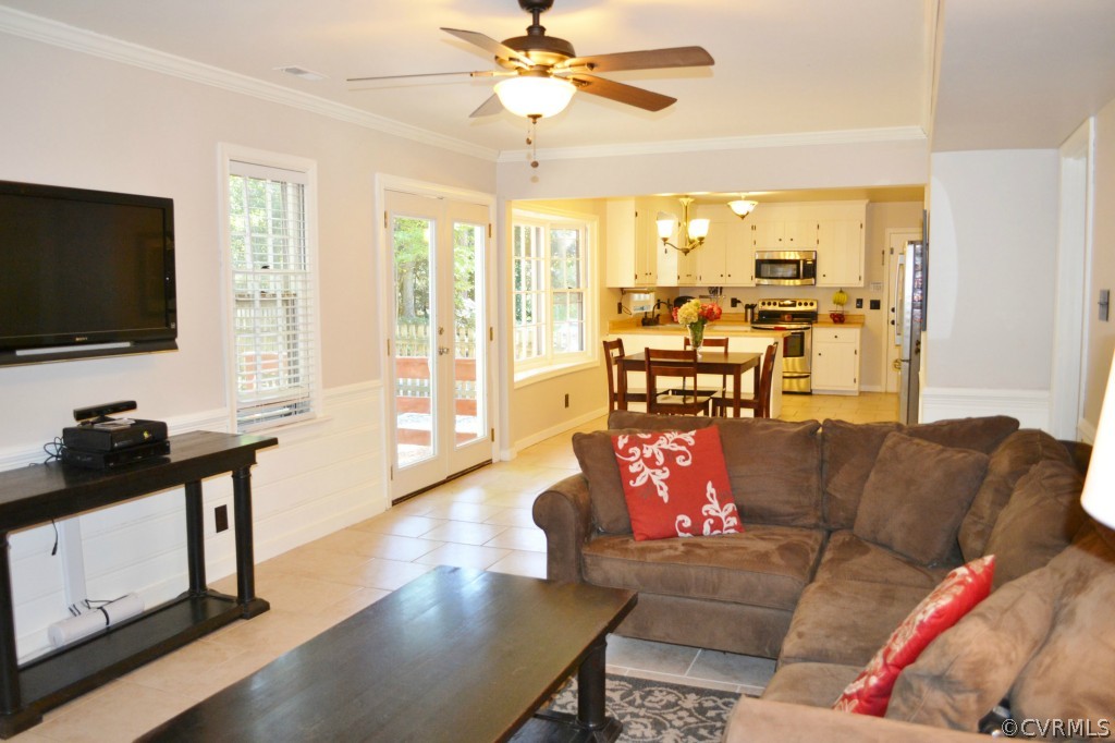 603 Fennimore Road Midlothian, VA 23114 - Photo 8 of 24 a living room with furniture flat screen tv and a large window