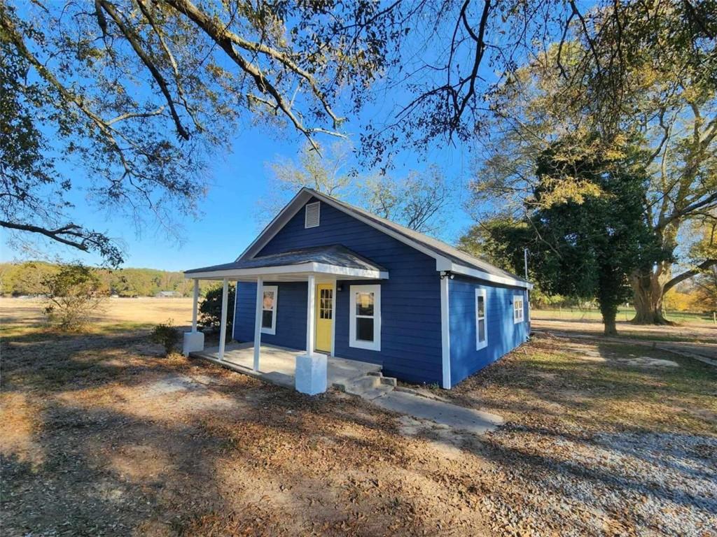 824 Lexington-Carlton Road Lexington, GA 30648 - Photo 1 of 1 a view of a house with a yard