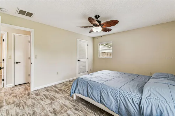a view of a room with wooden floor and closet