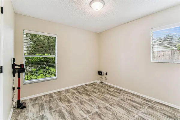 a kitchen with a sink a refrigerator and window