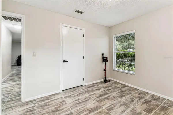 a front view of a house with chairs