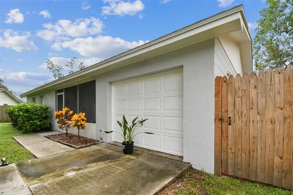 a view of a house with swimming pool and a yard