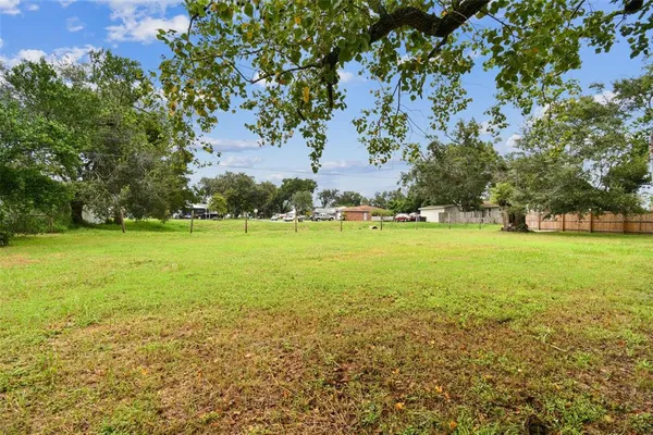 an aerial view of residential building with green space