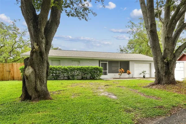 a bedroom with a bed and a television