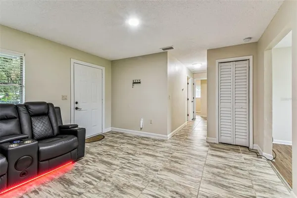 a kitchen with stainless steel appliances granite countertop white cabinets and a stove top oven