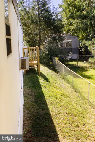 a swimming pool with trees in front of it