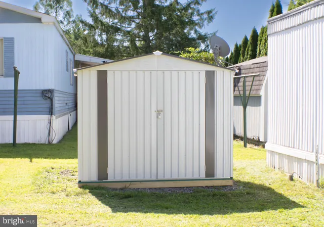 a view of a backyard with a small cabin