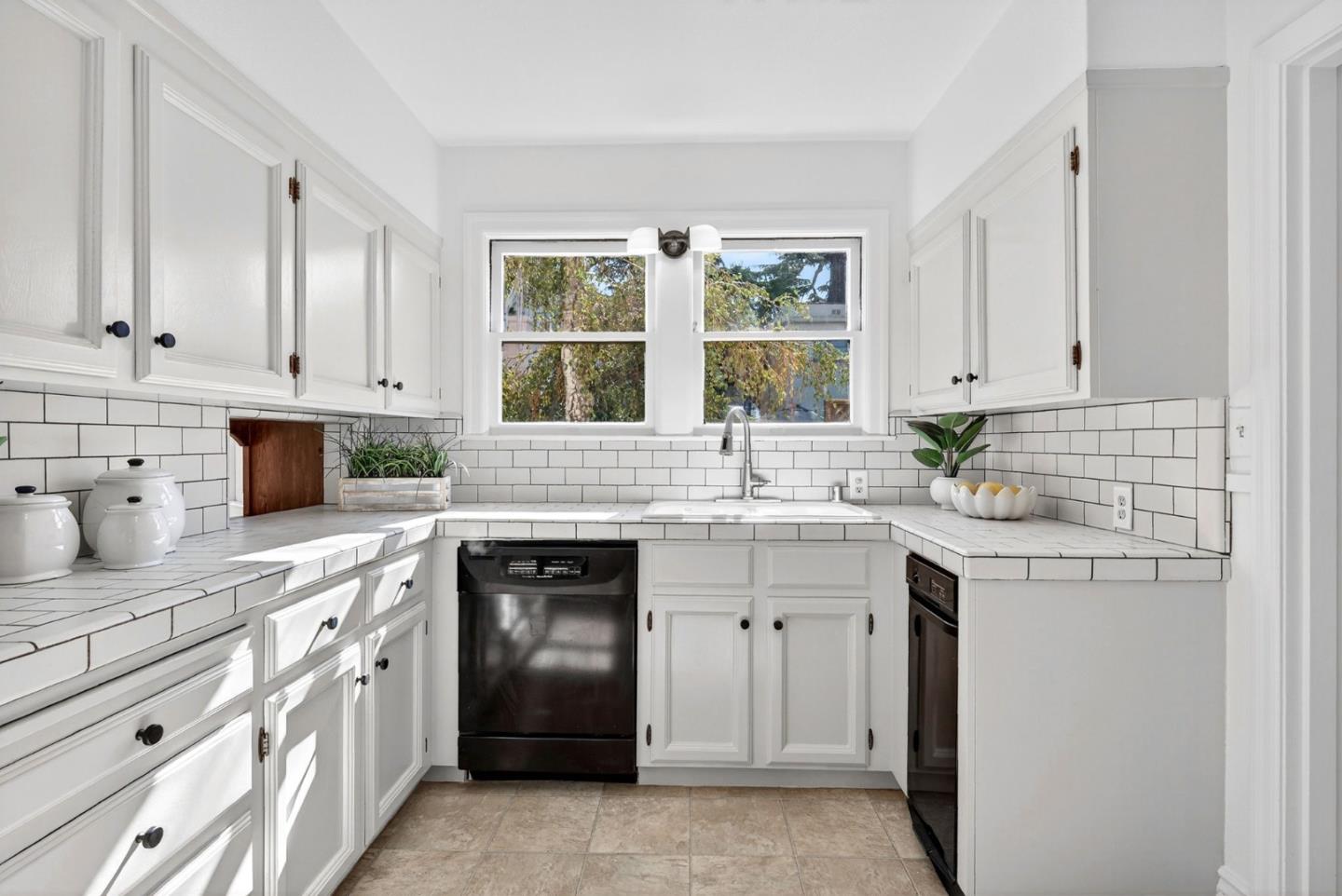 1087 Merle Avenue San Jose, CA 95125 - Photo 18 of 49 a kitchen with appliances cabinets and a sink