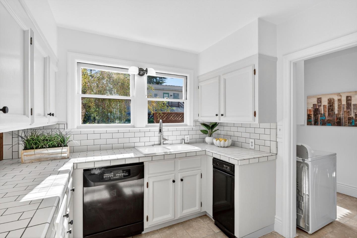 1087 Merle Avenue San Jose, CA 95125 - Photo 19 of 49 a kitchen with stainless steel appliances granite countertop a sink stove and cabinets