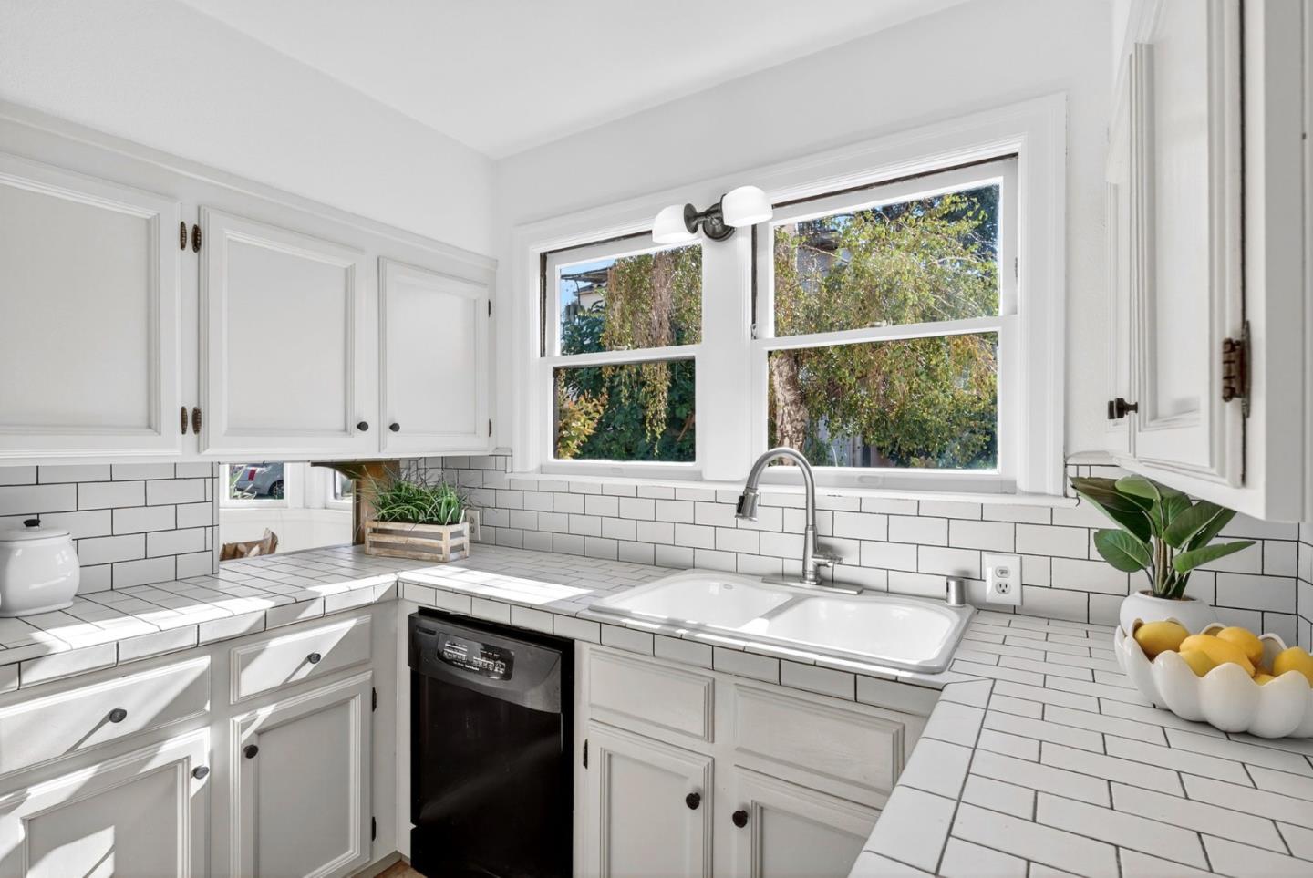 1087 Merle Avenue San Jose, CA 95125 - Photo 20 of 49 a kitchen with a sink cabinets and window