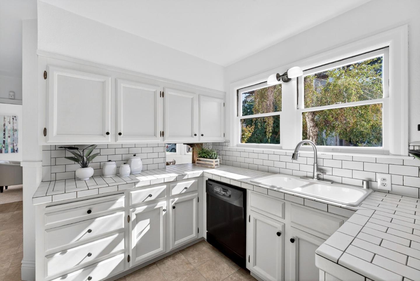 1087 Merle Avenue San Jose, CA 95125 - Photo 21 of 49 a kitchen with a sink stove and cabinets