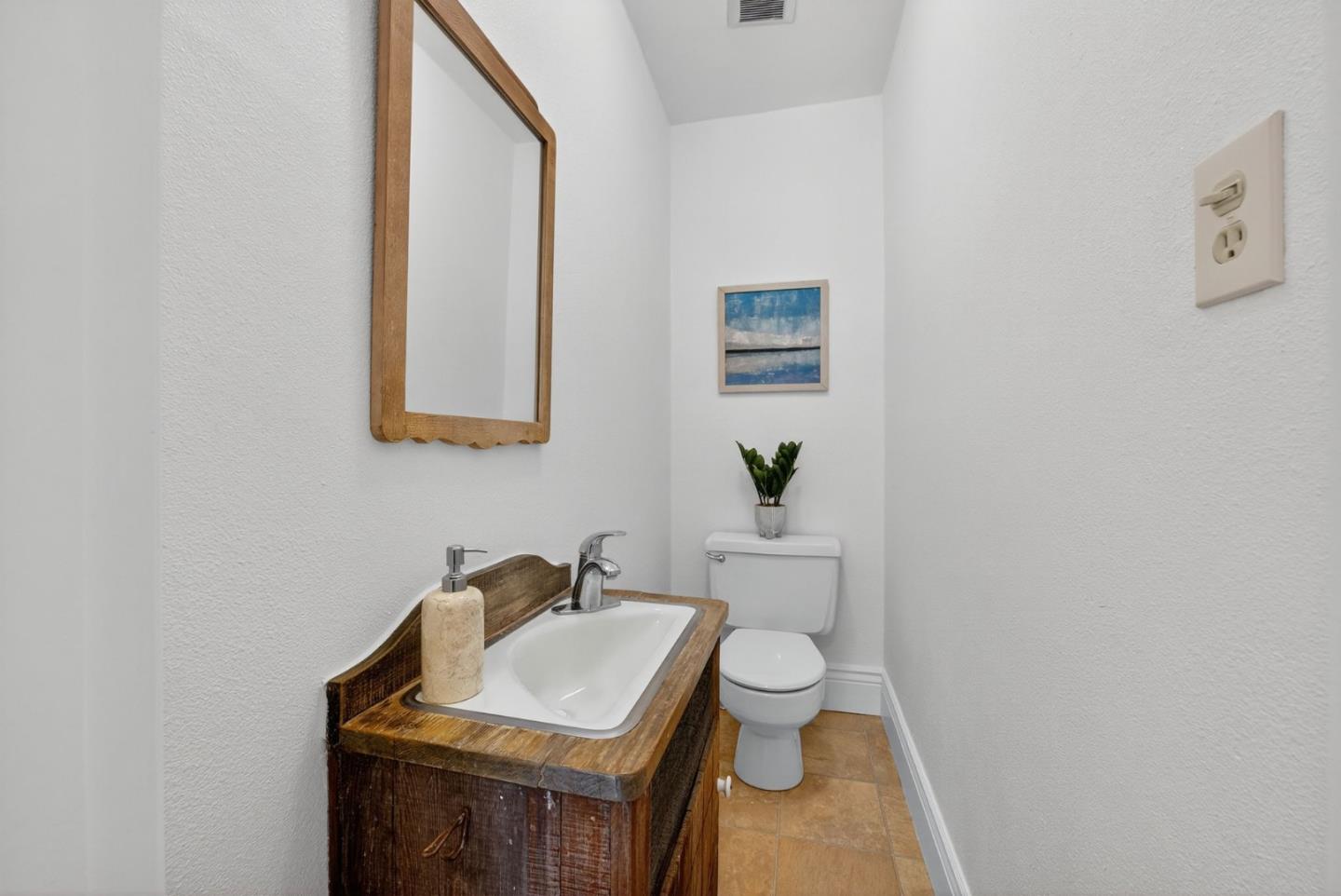 1087 Merle Avenue San Jose, CA 95125 - Photo 22 of 49 a bathroom with a toilet a sink and mirror