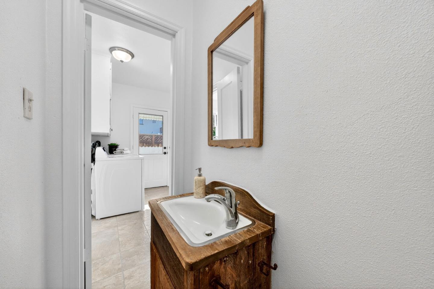 1087 Merle Avenue San Jose, CA 95125 - Photo 23 of 49 a bathroom with a sink and a mirror