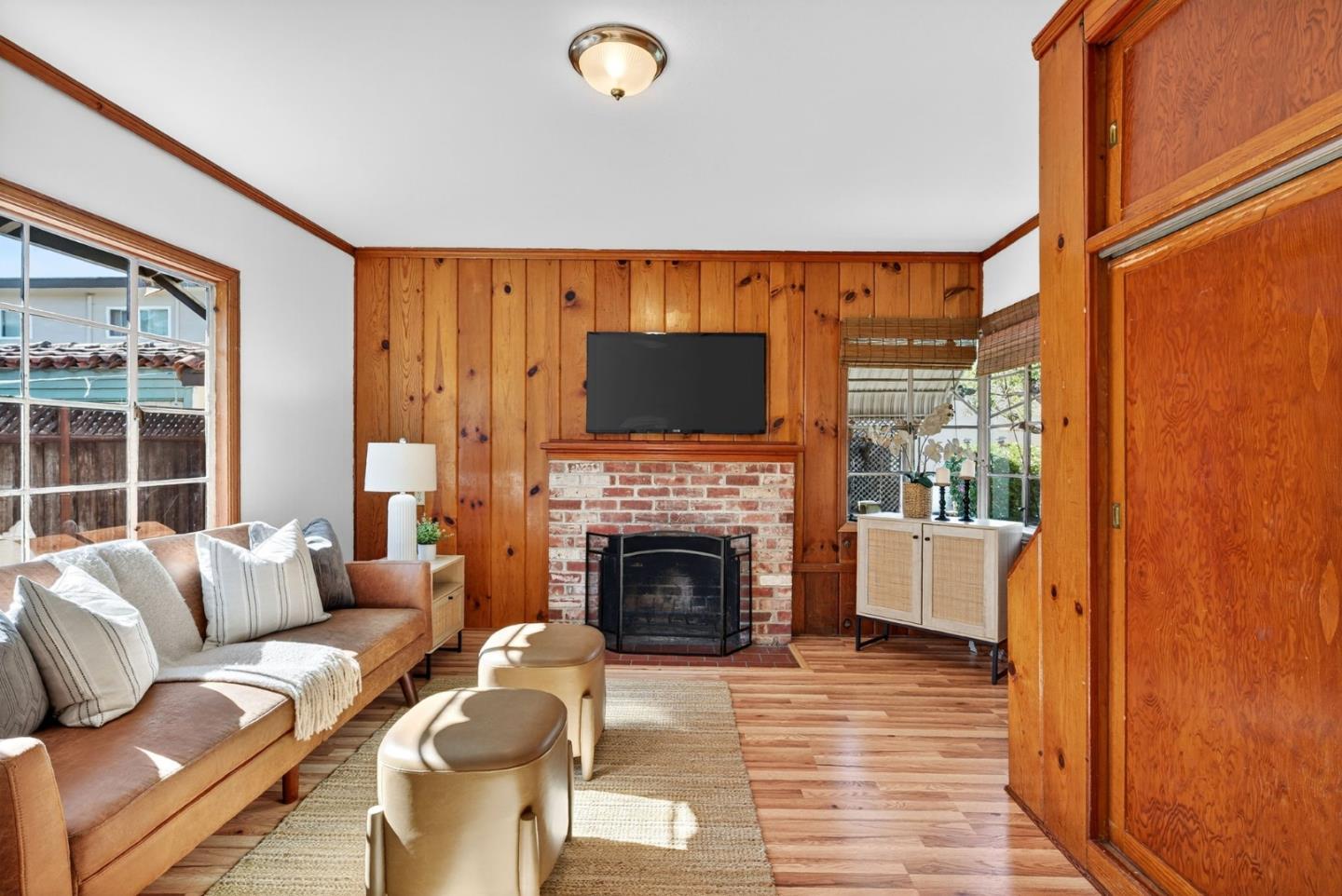 1087 Merle Avenue San Jose, CA 95125 - Photo 24 of 49 a living room with furniture a fireplace and a flat screen tv