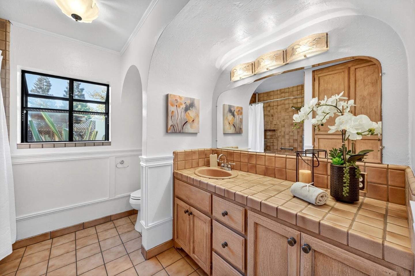 1087 Merle Avenue San Jose, CA 95125 - Photo 31 of 49 a bathroom with a granite countertop sink and a mirror