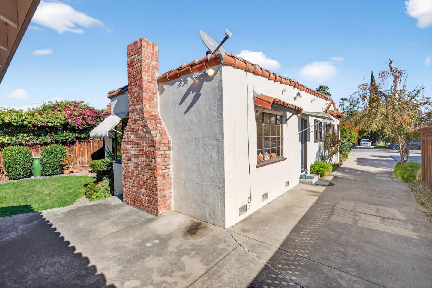 1087 Merle Avenue San Jose, CA 95125 - Photo 45 of 49 a front view of a house with a yard and garage