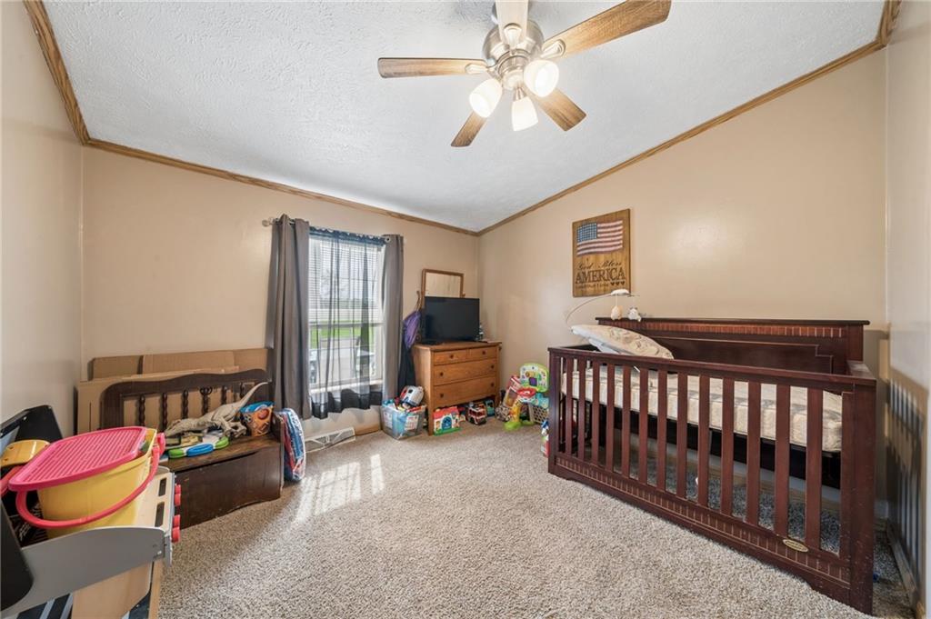 275 Adamik Road Clarksville, PA 15322 - Photo 21 of 39 a bedroom with furniture and a large window