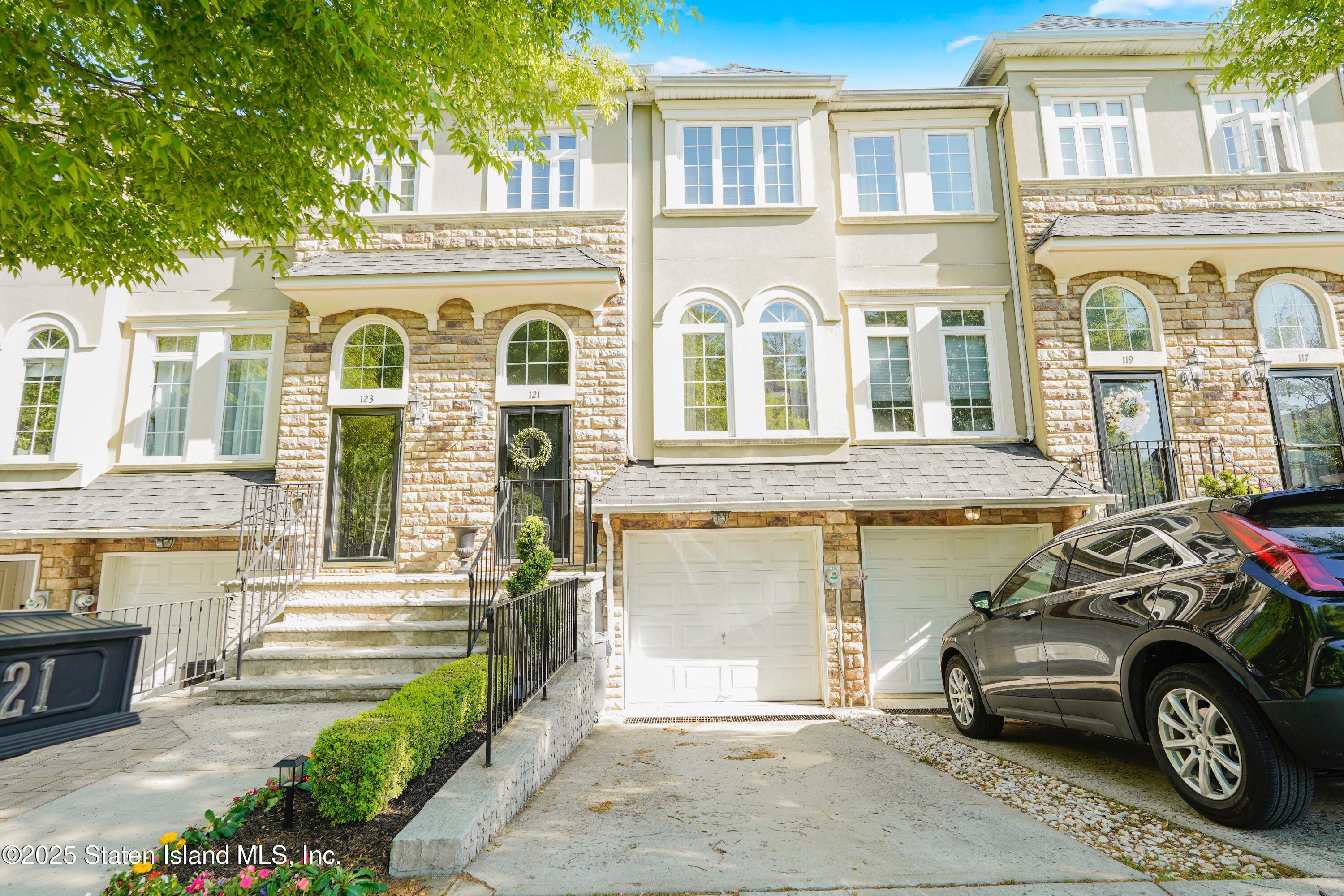 a front view of a house with parking space