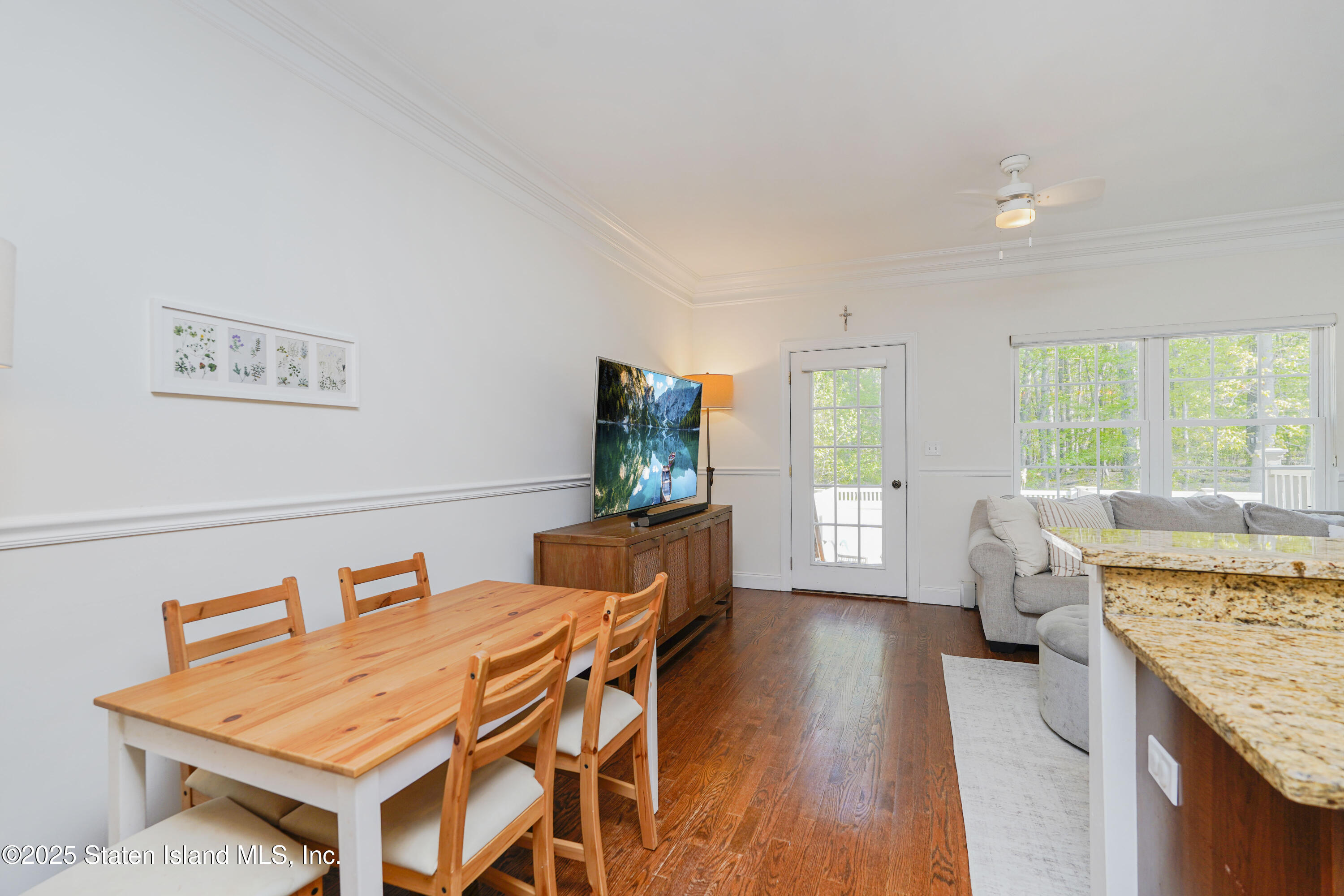 121 Presentation Circle Staten Island, NY 10312 - Photo 16 of 39 a living room with furniture and a flat screen tv