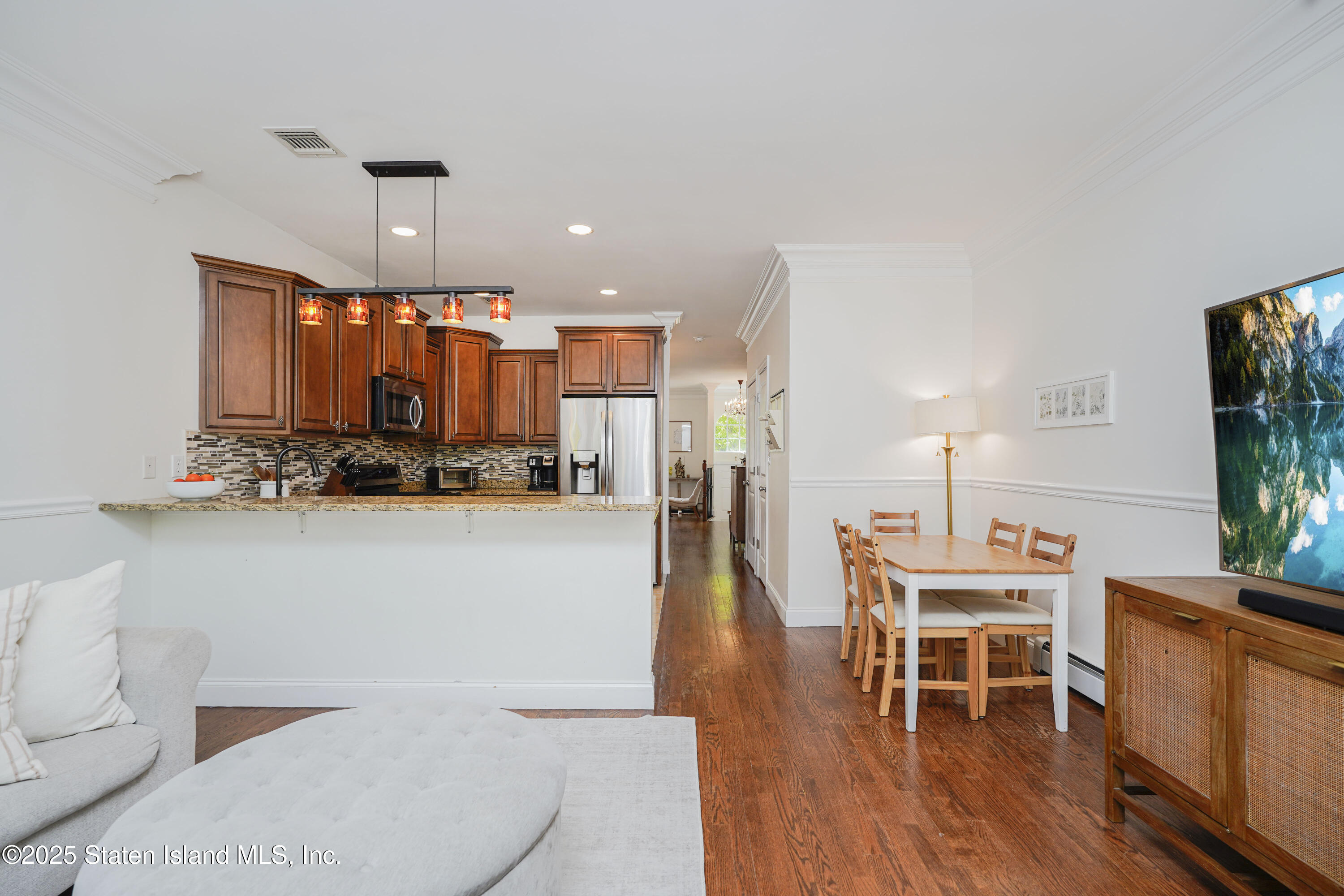 121 Presentation Circle Staten Island, NY 10312 - Photo 19 of 39 a view of a kitchen and dining room