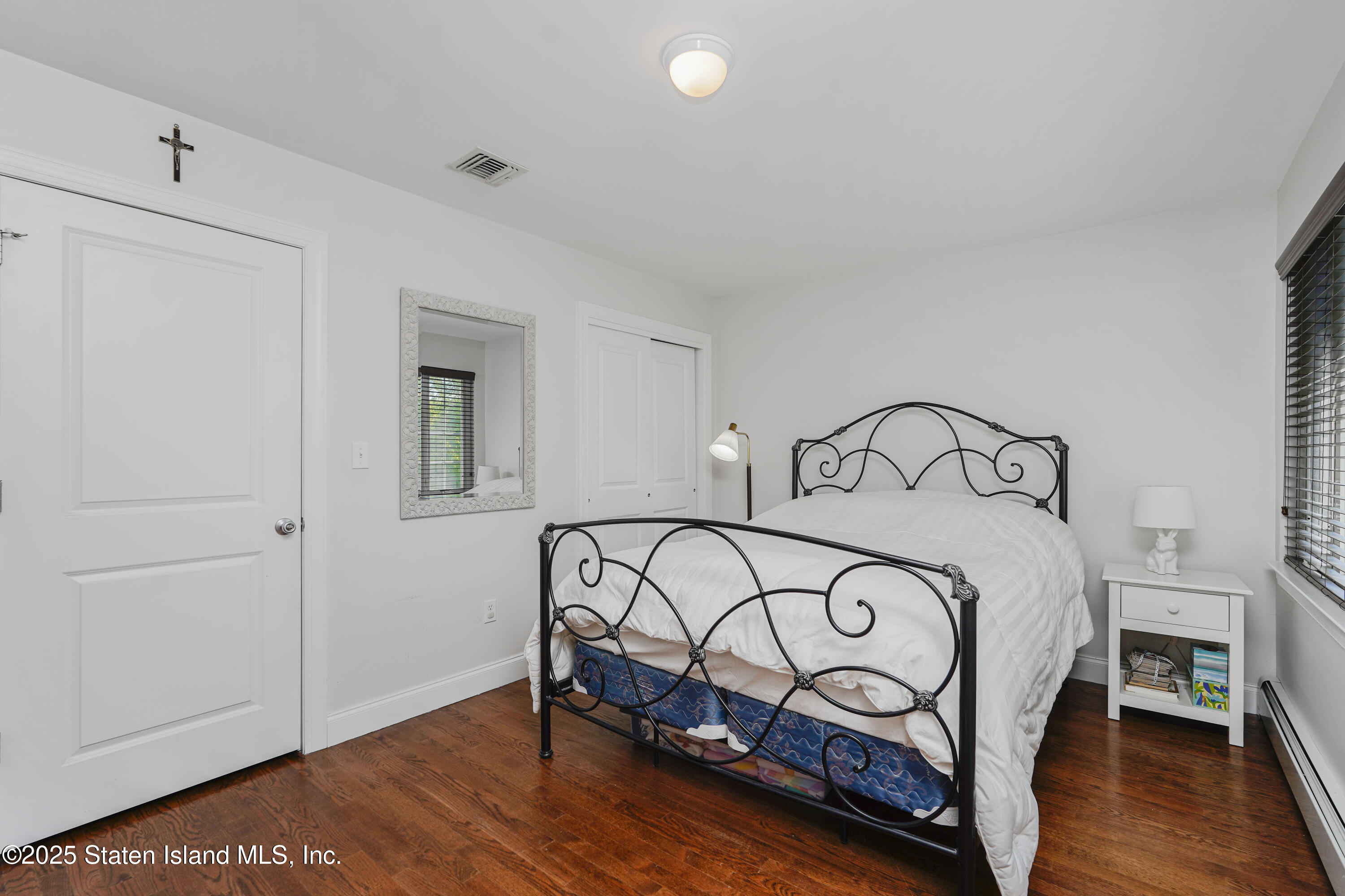 121 Presentation Circle Staten Island, NY 10312 - Photo 28 of 39 a bedroom with a bed and a window