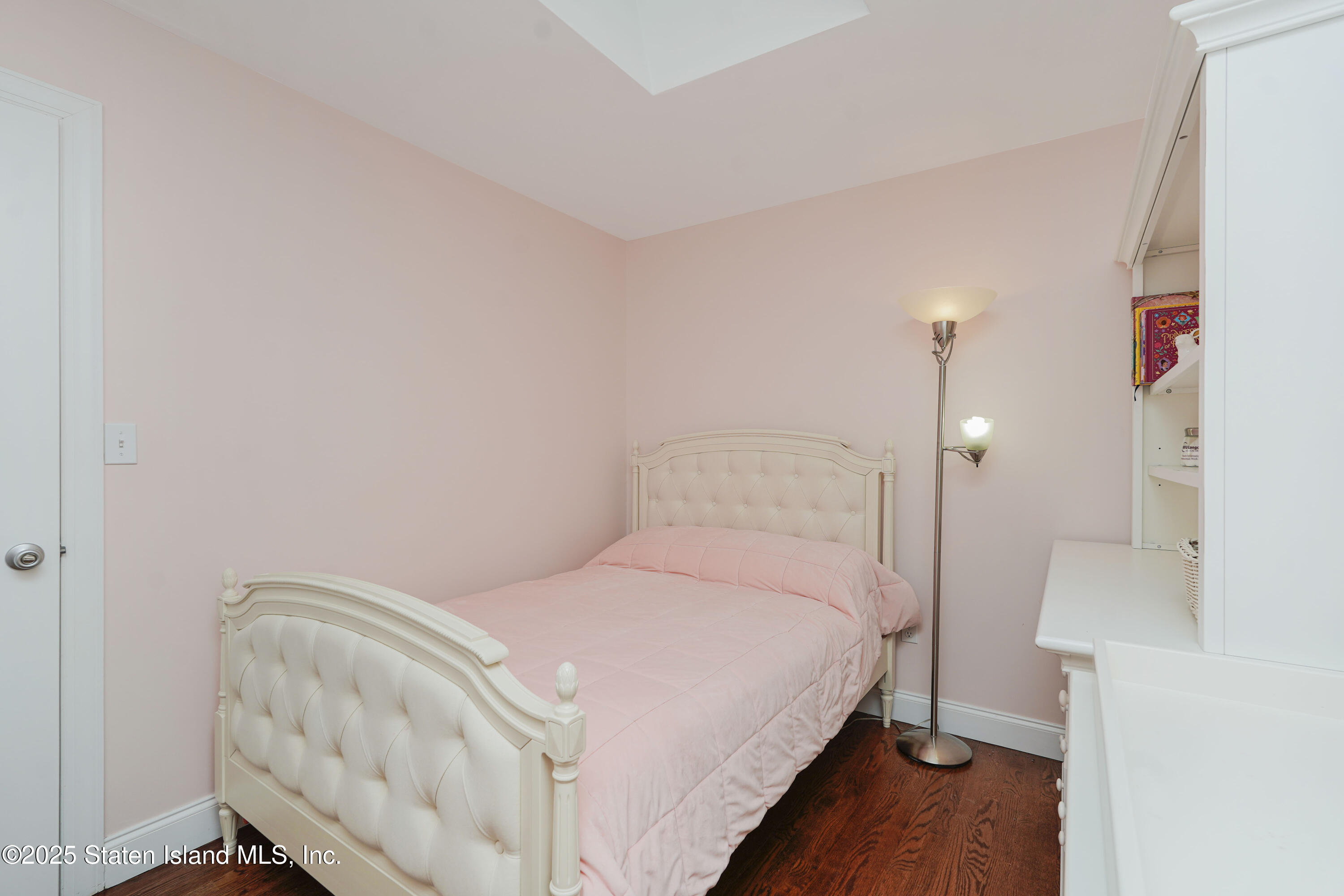 121 Presentation Circle Staten Island, NY 10312 - Photo 30 of 39 a bedroom with a bed and a mirror
