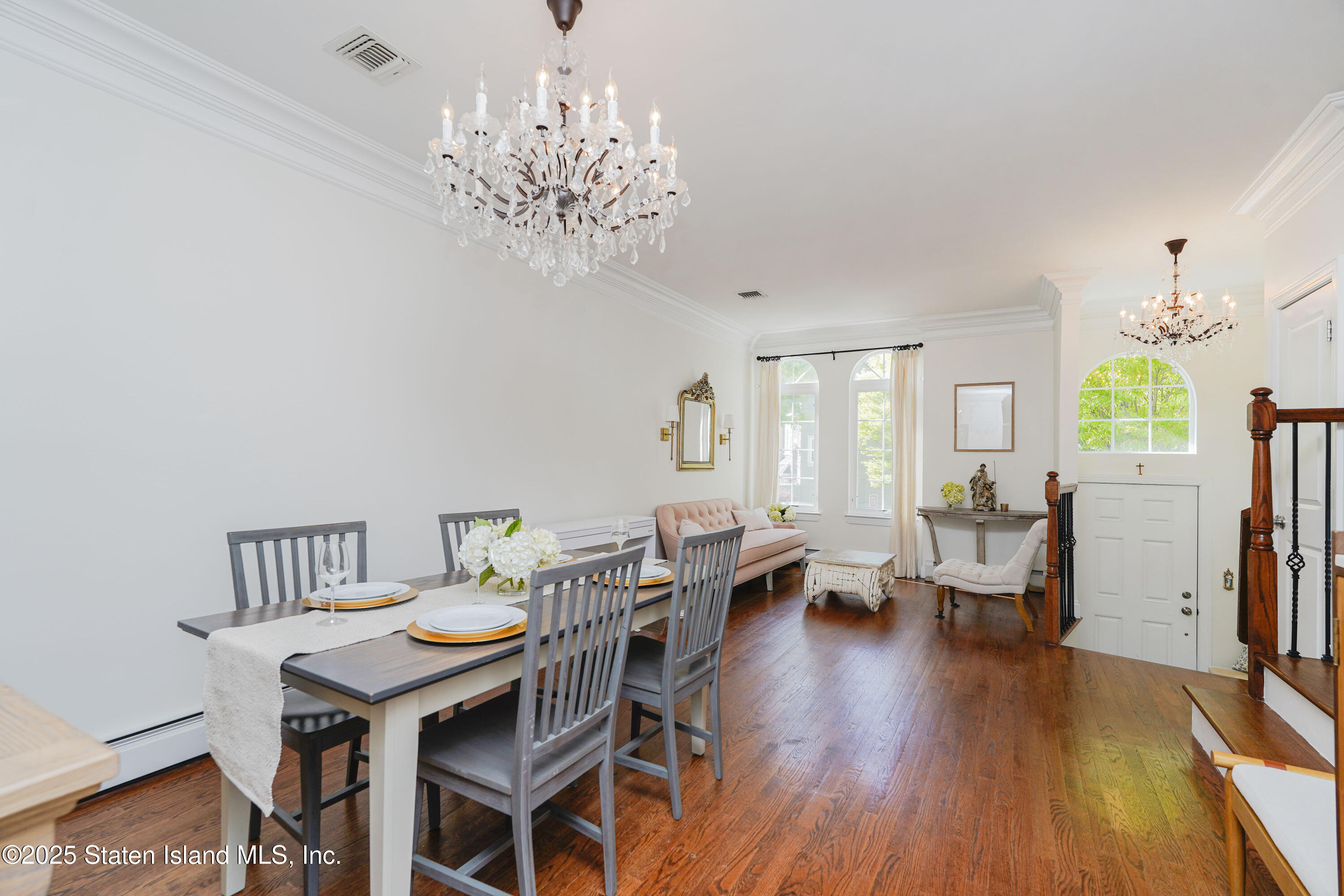 121 Presentation Circle Staten Island, NY 10312 - Photo 10 of 39 a view of a dining room with furniture wooden floor and chandelier