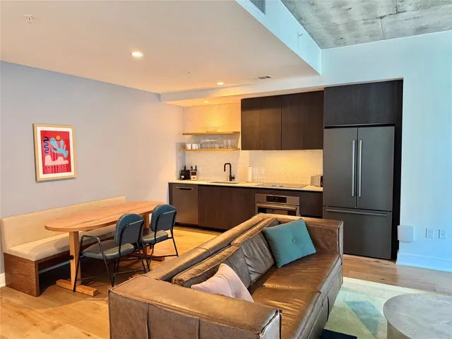 a living room with a couch and a projector screen