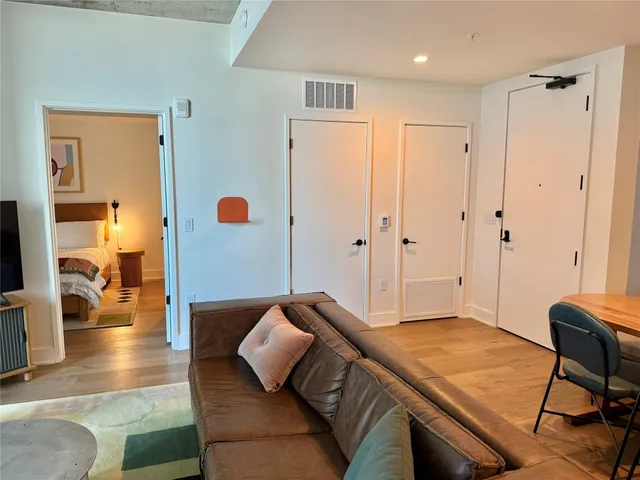 a bedroom with a bed and a table in it