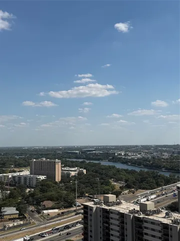 a view of a lake and middle of a city