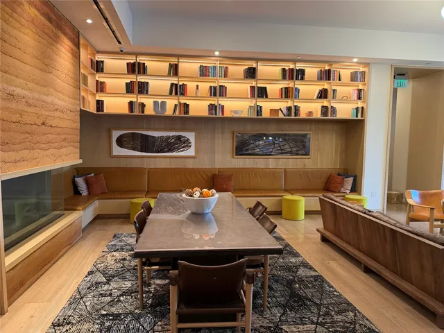 a kitchen with a sink and a stove with wooden floor