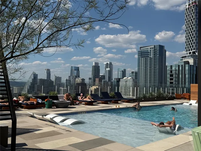 a view of a park with swings and slides