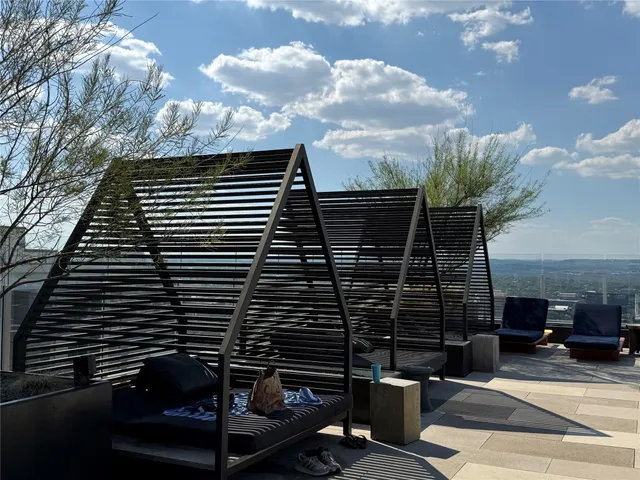 a view of barbeque area with wooden stairs